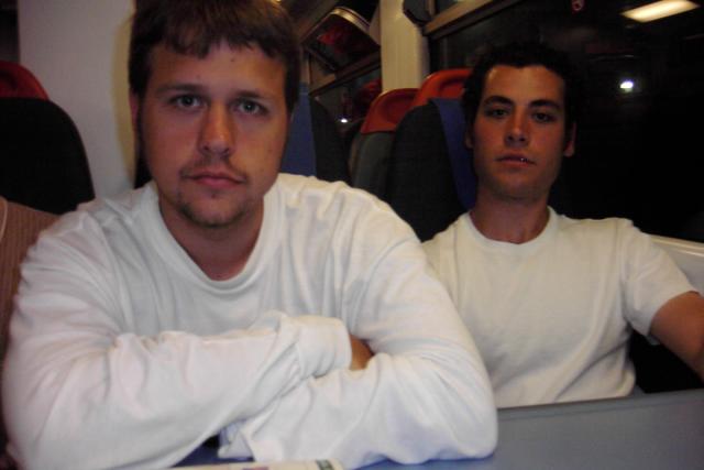 John and Eric looking thrilled to be on a train.