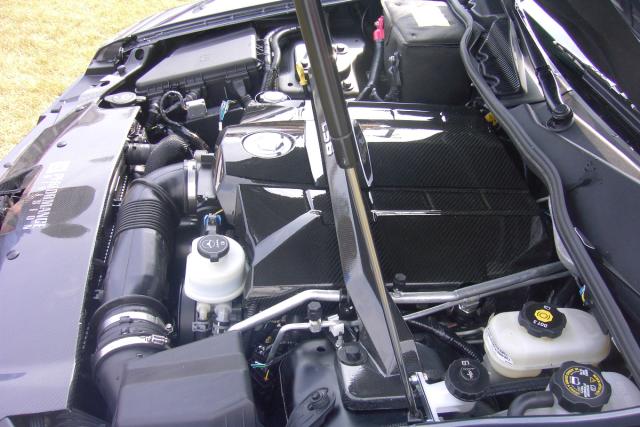 CTS M1 (engine bay w/carbon fiber engine cover, strut-tower brace, and various performance bits)