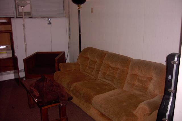 Here is the couch and an uncomfortable chair in the living room.