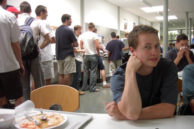 Jason, after eating in the Mensa.  The line on the left is waiting for some cheap, delicious German food.