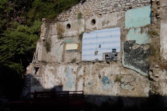 Walking around in Patras, I noticed this bath surround attached to a stone wall.  If you look closely, you can see the soap tray!